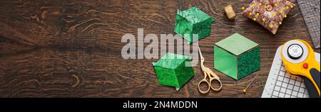 Diamonds stitched in the form of a cube. The process of sewing a quilt. Stock Photo