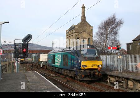 Direct Rail Services class 68 locomotives, 66016 Fearless and 68001 Evolution, approaching Carnforth station on nuclear flask train 8th February 2023. Stock Photo