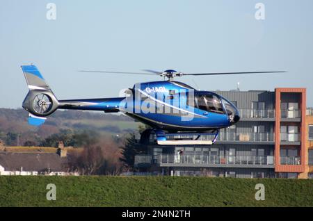 A Eurocopter EC 120 Colibri helicopter arriving at Brighton City Airport Stock Photo