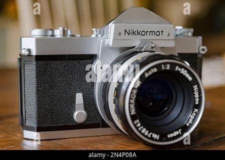 Vintage 1960's or 1970's Nikon Nikkormat FTN single lens reflex (SLR) film camera or with a 50mm f2 standard lens. Stock Photo