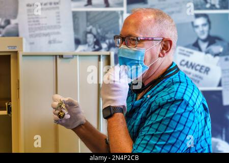Visitor holds the keys to Elvis Presley’s Cadillac during a VIP Tour at Graceland, his home in Memphis, Tennessee. Stock Photo