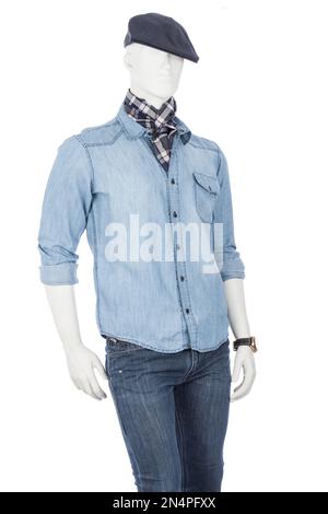 Male mannequin dressed in a shirt with blue jean beret and plaid scarf on white background. Stock Photo