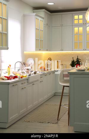 Dirty dishes in kitchen after new year party Stock Photo