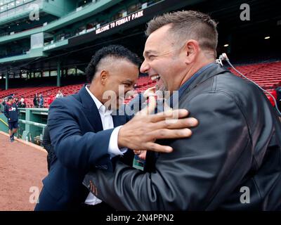 Former Boston Red Sox's Manny Ramirez, left, displays his Boston Red Sox  Hall of Fame plaque during a pre-game ceremony as former teammate David  Ortiz, right, looks on before a baseball game