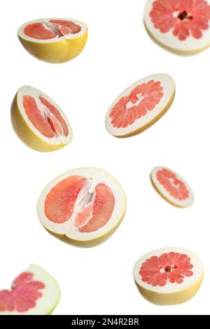 Fresh exotic pomelo fruits falling on white background Stock Photo