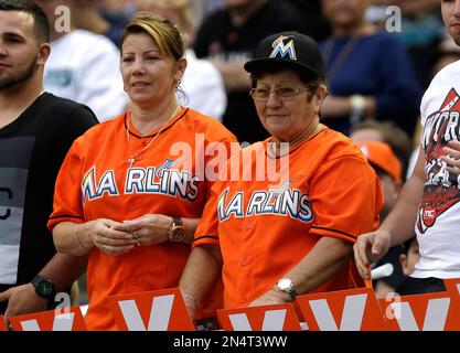 Olga Fernandez, of Cuba, left, walks with her daughter Maritza