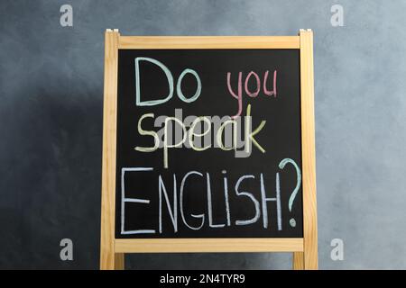 Blackboard with question Do You Speak English on grey background Stock Photo