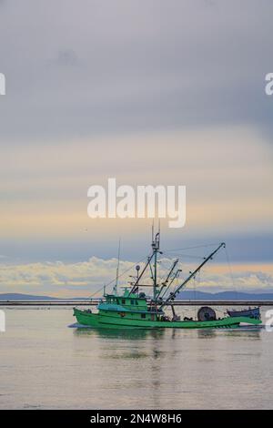 Colourful commercial fishing boat returning to Steveston in British Columbia Canada Stock Photo
