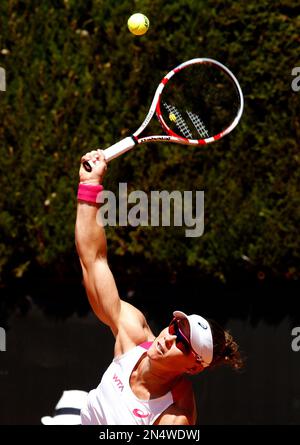 Australia's Samantha Stosur returns a ball to Switzerland's Stefanie