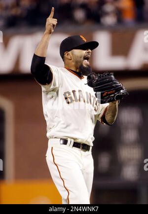 The San Francisco Giants' Sergio Romo dons a championship shirt after an  8-4 win over the San Diego Padres to clinch the NL West at AT&T Park in San  Francisco, California, on