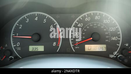 Car speedometer in sunlight with gas showing Stock Photo