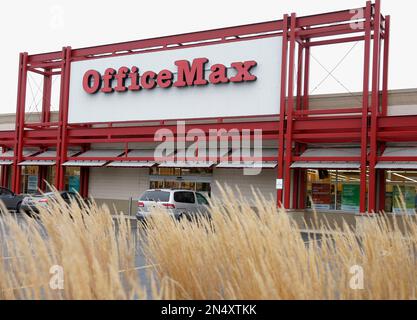 FILE - This Nov. 1, 2013 file photo shows the exterior of an Office Max  store in Chicago. Office Depot is planning to close at least 400 .  stores, as its merger