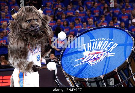 The Oklahoma City Thunder mascot dunks the ball during a stoppage in play  against the Houston Rockets at Chesapeake Energy Arena.
