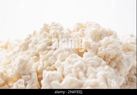 Rice malt placed against a white background. Koji mold. Koji is fermented rice. Stock Photo