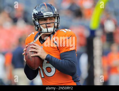 In this Aug. 18, 2012, photo, Denver Broncos quarterback Caleb Hanie warms  up for NFL football preseason game against the Seattle Seahawks in Denver.  The Dallas Cowboys have added another quarterback with