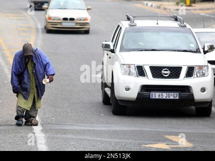 A man begs for spare change Stock Photo - Alamy