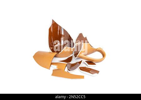 Shattered coffee mug pieces on white background Stock Photo