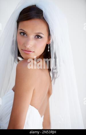 Looking great for her wedding. A beautiful bride looking over her shoulder. Stock Photo