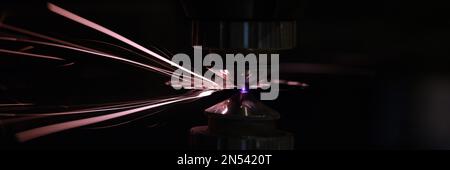 Process of cutting metal using plasma cutting in dark Stock Photo