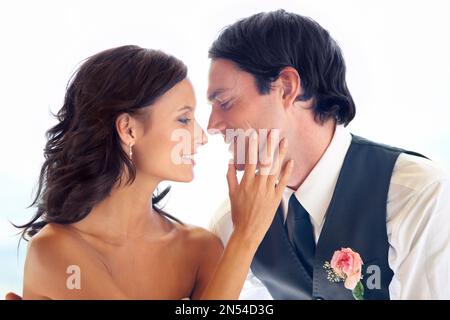 They share a bright future. A happy newlywed couple looking at each other. Stock Photo