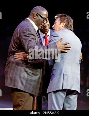 Former NBA player and president of basketball operations for the Detroit  Pistons, Joe Dumars, left, is congratulated by former teammate and  presenter Isiah Thomas at Dumars' enshrinement into the Naismith Memorial  Basketball