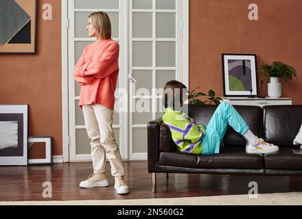 Young mother having quarrel with her daughter, they dont talk to each other Stock Photo