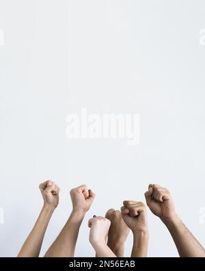 people holding fists up together . Resolution and high quality beautiful photo Stock Photo