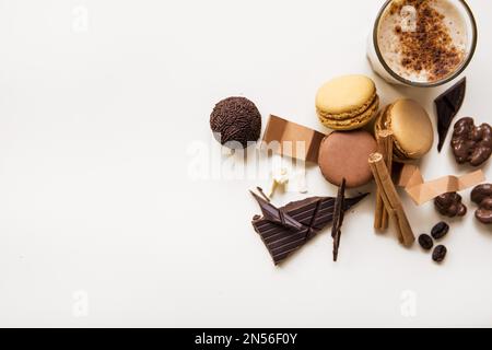 overhead view macaroons chocolate ball coffee glass white background . Resolution and high quality beautiful photo Stock Photo