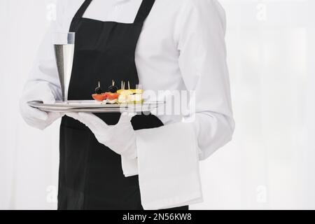 servant uniform holding tray. Resolution and high quality beautiful photo Stock Photo
