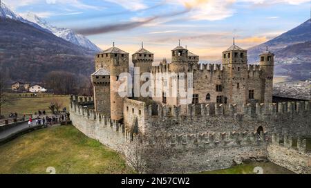 one of the most beautiful and famous medieval castles of Italy Castello di Fenis in Valle d'Aosta , aerial drone view Stock Photo