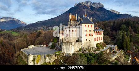 Most beautiful medieval castles of France - fairytale Menthon located near lake Annecy. aerial view Stock Photo