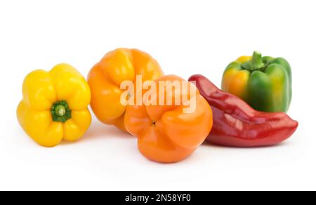 colored peppers over white background Stock Photo