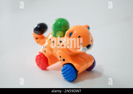 Children's plastic toy. Green ladybug car on a white background. Stock Photo