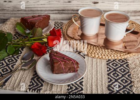 https://l450v.alamy.com/450v/2n5a033/aesthetic-breakfast-with-chocolate-cherry-cake-pieces-coffee-cups-red-roses-and-st-valentines-day-2n5a033.jpg