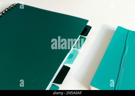 green notebooks with tags isolated on white background with copyspace Stock Photo