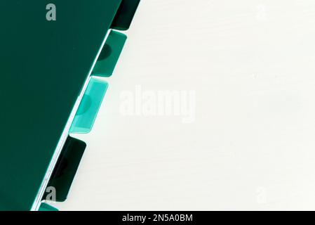 green notebook with tags isolated on white background with copyspace Stock Photo