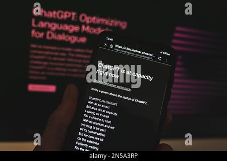 ChatGPT Open AI chat bot server error message on phone screen. Chat GPT is at capacity right now. Warsaw, Poland - February 8, 2023. Stock Photo
