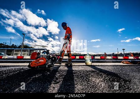 Railway workers building new railway and knocking down bridges Stock Photo
