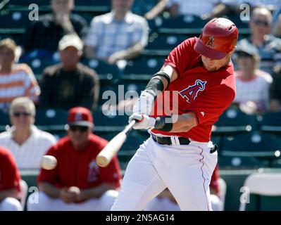 Texas Rangers' Kole Calhoun hits against the Arizona Diamondbacks during  the first inning of a spring training baseball game Tuesday, March 22,  2022, in Scottsdale, Ariz. (AP Photo/Matt York Stock Photo - Alamy