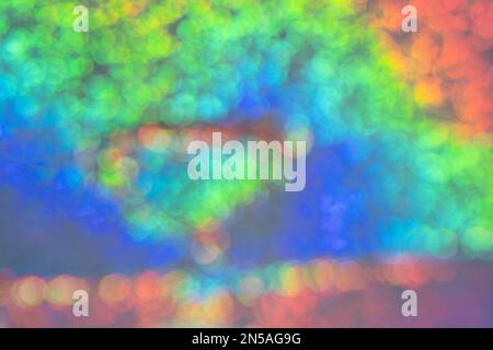 Blurred Iridescent holographic foil background with bokeh. Soft pastel colors backdrop. Trendy creative gradient. Stock Photo