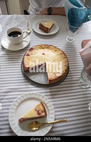 A slice of classic cake in Sweden. Fika with black coffee and Strawberry Pie. Midsummer in Sweden. Stock Photo