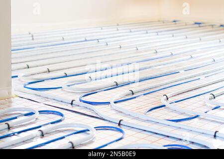 Underfloor heating system installation.  Individual Heating. Stock Photo