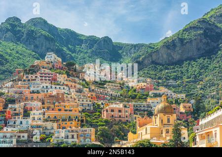 View of Positano town with colorful buildings and church of Our Lady of the Assumption on Amalfi coast, Campania, Italy. Popular summer resort Stock Photo