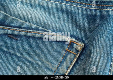 Blue jeans fabric denim texture with a pocket Stock Photo