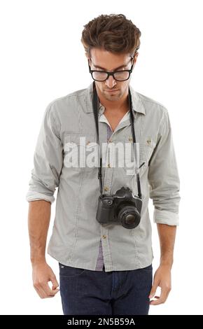 Checking out the sights. A handsome young photographer with his camera around his neck. Stock Photo