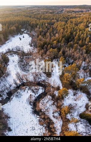 River winding through rural landscape in early spring Stock Photo