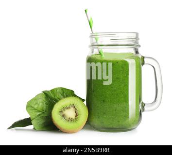 Green juice in mason jar and fresh ingredients on white background Stock Photo