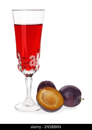 Delicious plum liquor and ripe fruits on white background. Homemade strong alcoholic beverage Stock Photo