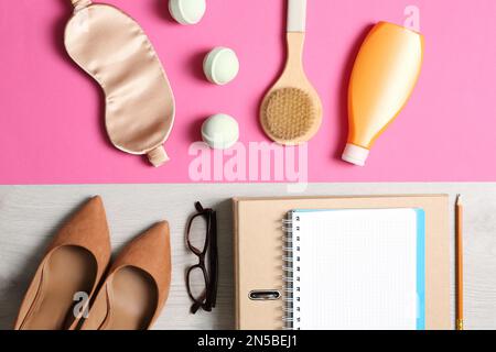 Flat lay composition with business items and bathroom accessories on color background. Concept of balance between work and life Stock Photo