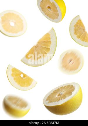 Fresh exotic pomelo fruits falling on white background Stock Photo